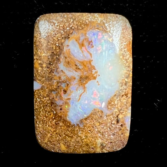 A polished, drilled pipe boulder opal bead.