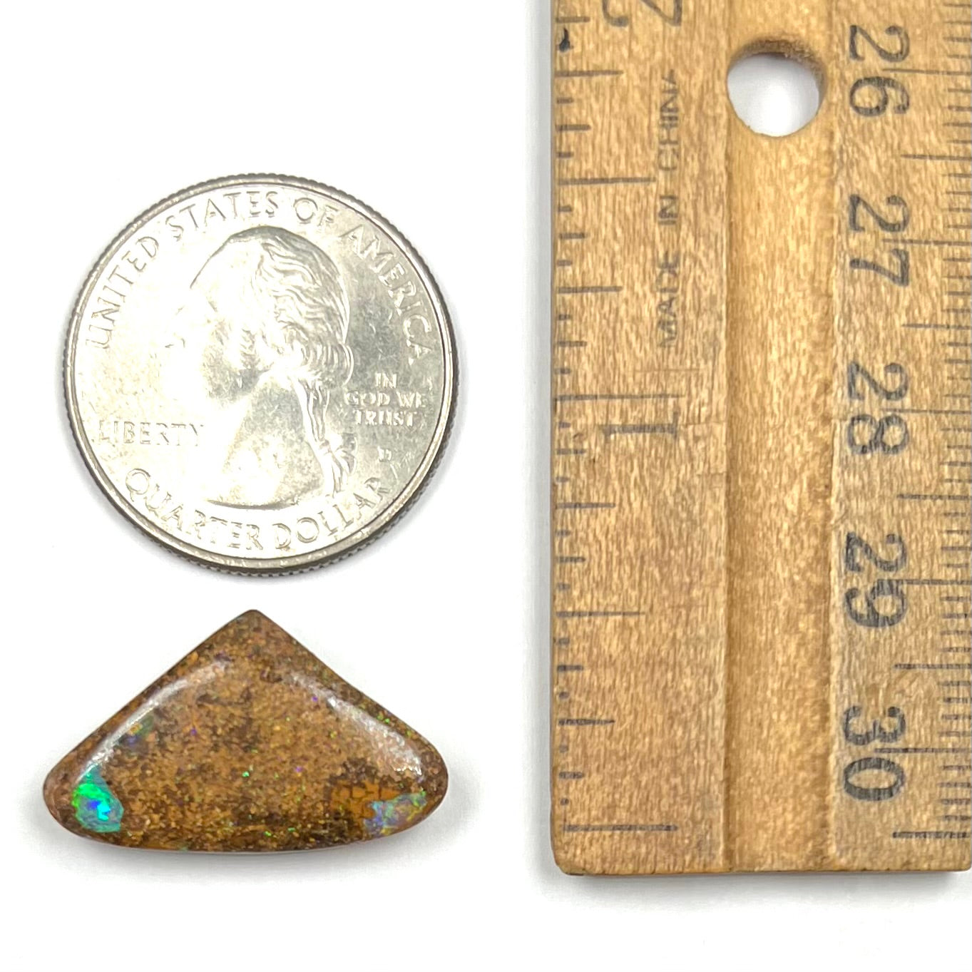 A polished, drilled pipe boulder opal bead.