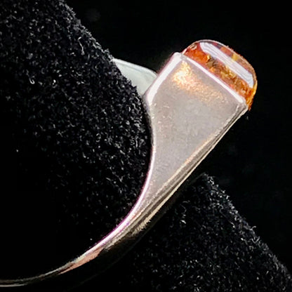Square shaped Baltic Amber cabochon set in a unique sterling silver ring.