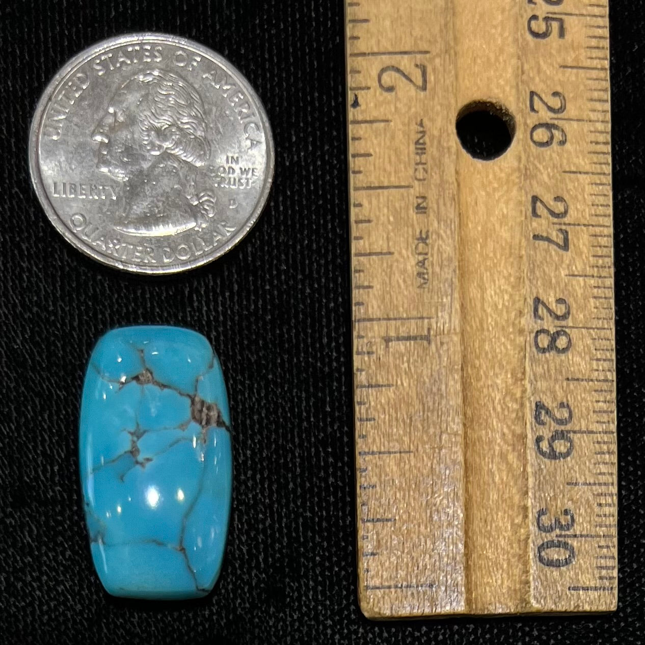 A loose, barrel cabochon cut blue turquoise stone from Burro Mountains, New Mexico.