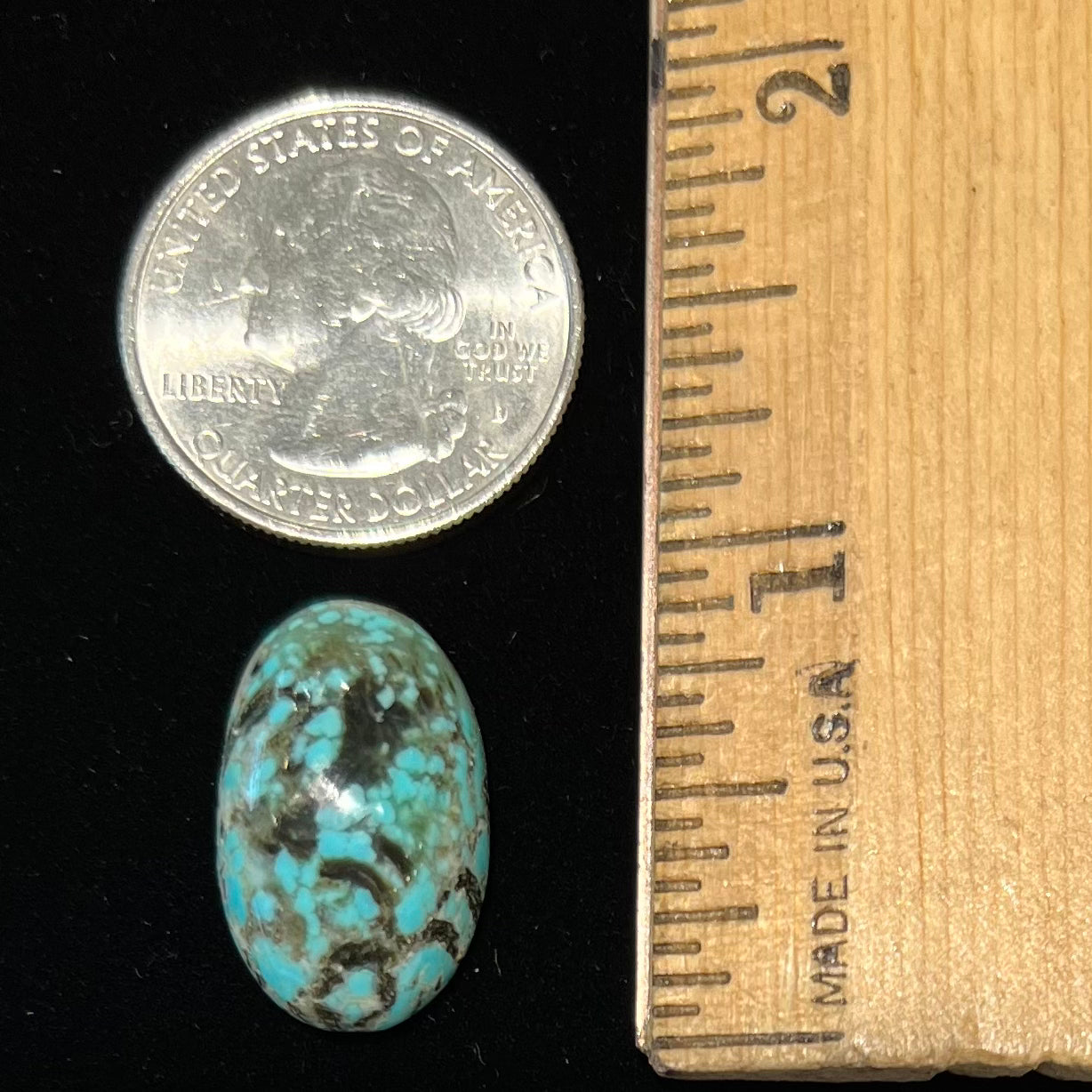 A loose, oval cabochon cut turquoise stone from Valley Blue Mine in Lander County, Nevada.