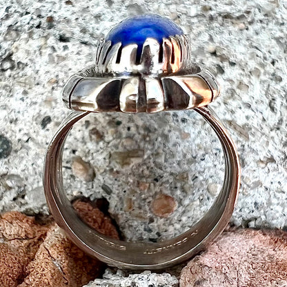 A Navajo style sterling silver lapis lazuli ring engraved with the words "R. Bennett".