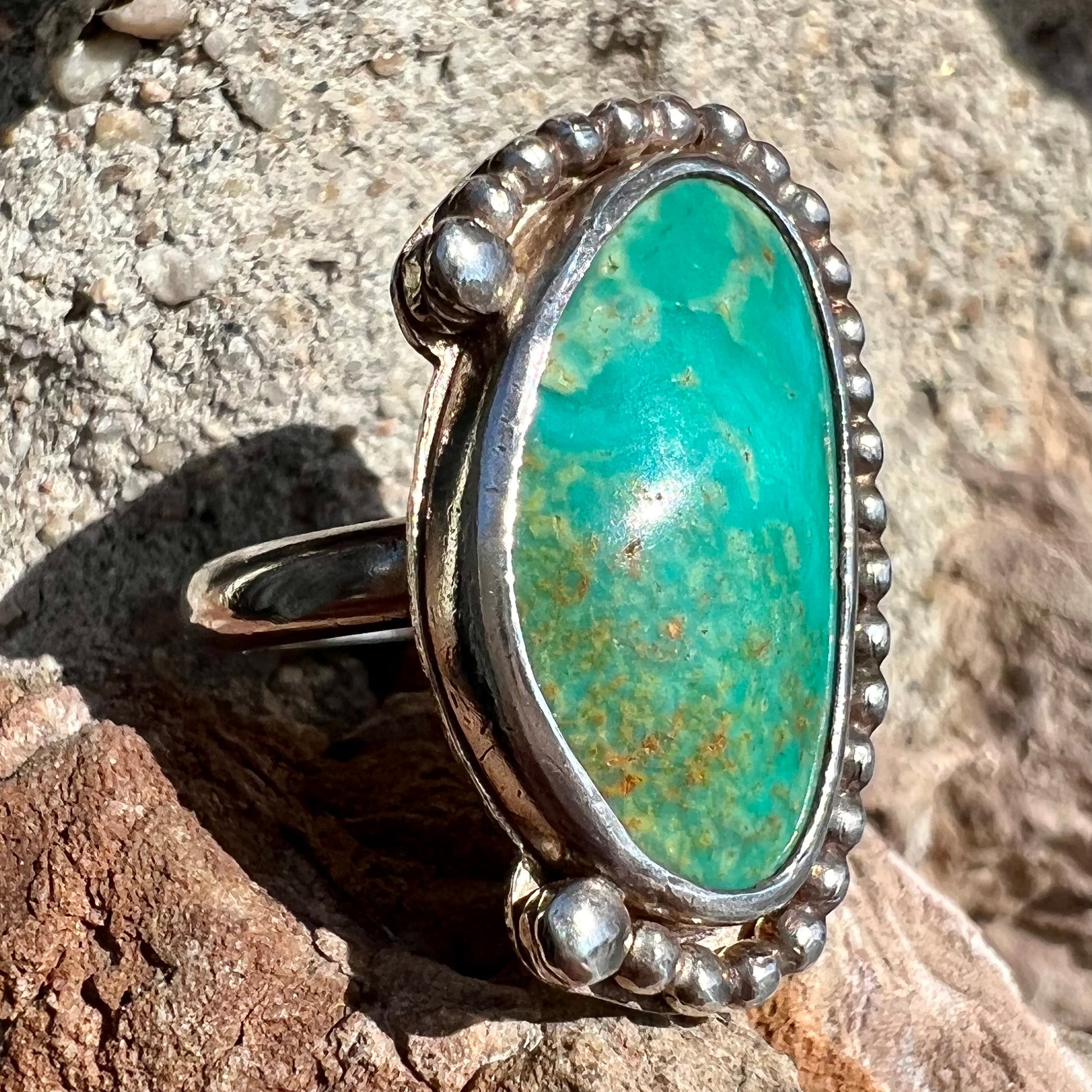 A sterling silver, Native American style green turquoise ring.  The turquoise is from the Royston Mining District.