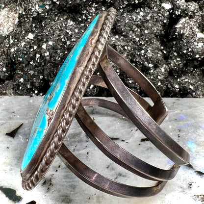 A sterling silver Morenci turquoise cuff bracelet.  The turquoise is large and has orange copper veins.
