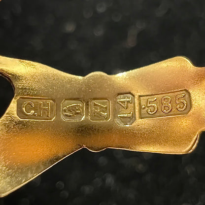 A ladies' 14 karat yellow gold Irish claddagh ring stamped with the maker's hallmarks.