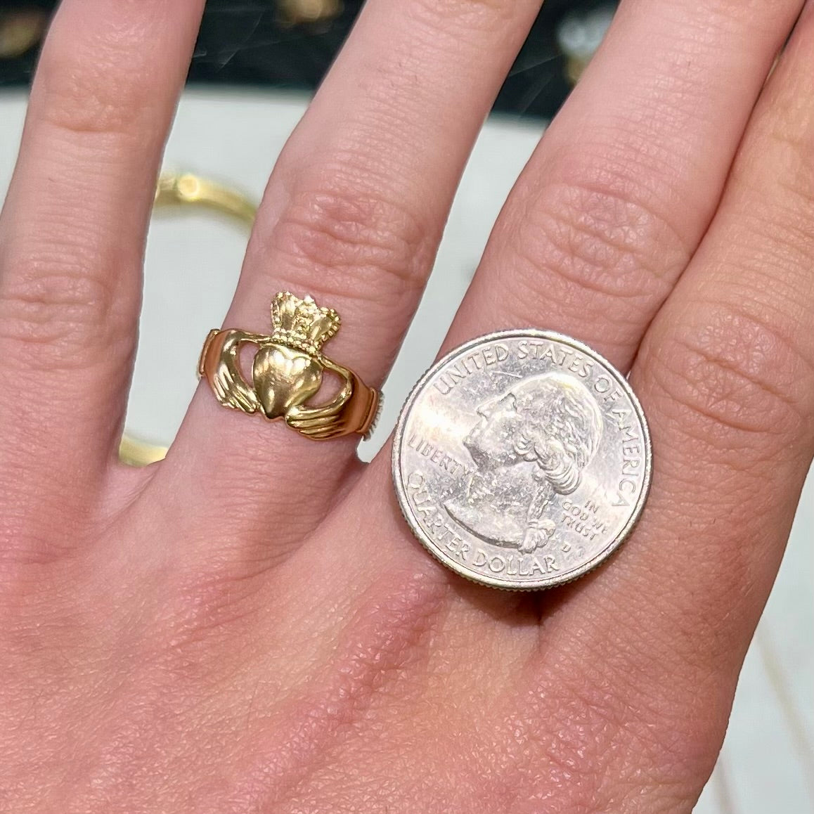 A ladies' 14 karat yellow gold Irish claddagh ring stamped with the maker's hallmarks.