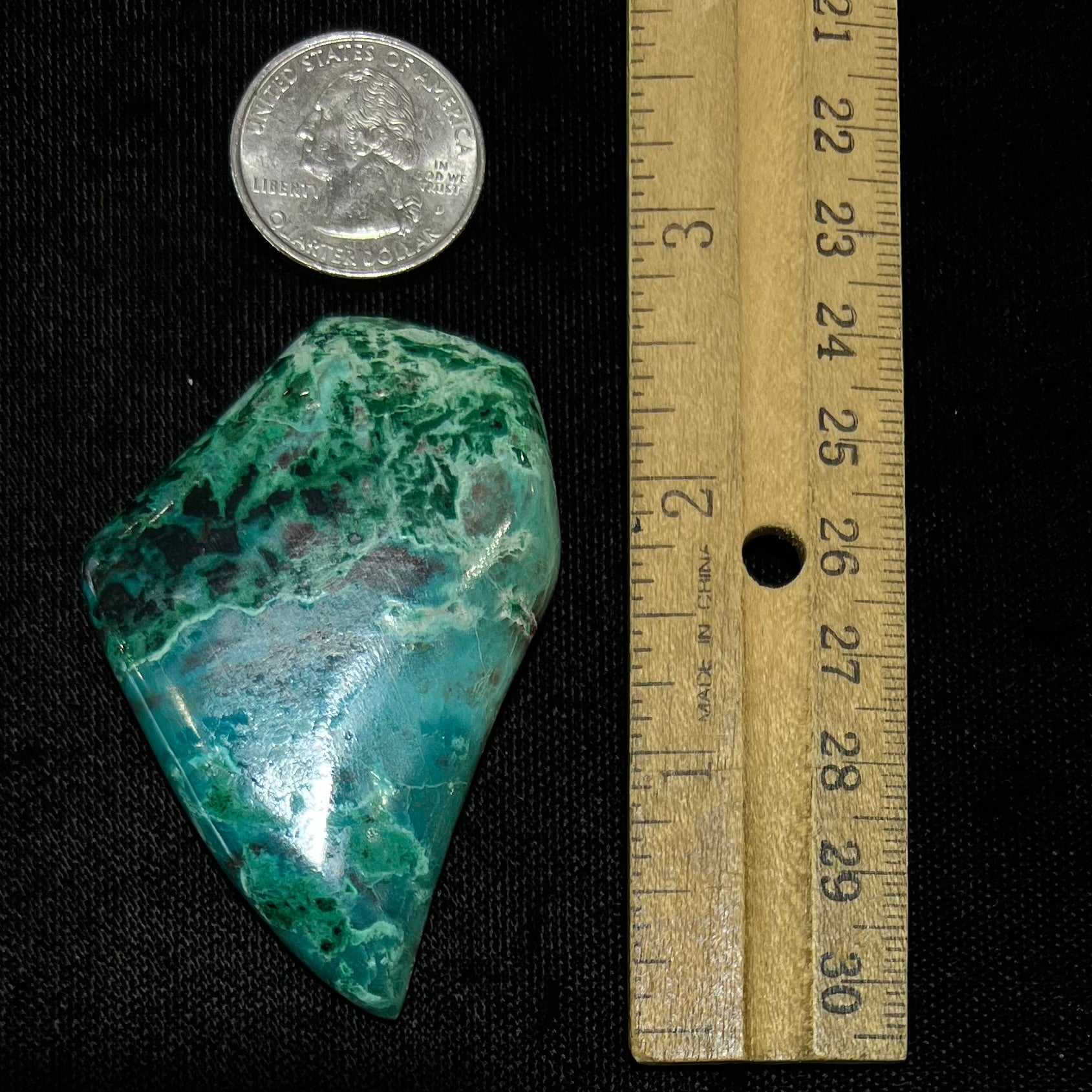 A polished, freeform shaped Eilat stone from King Solomon's Mine, Israel.