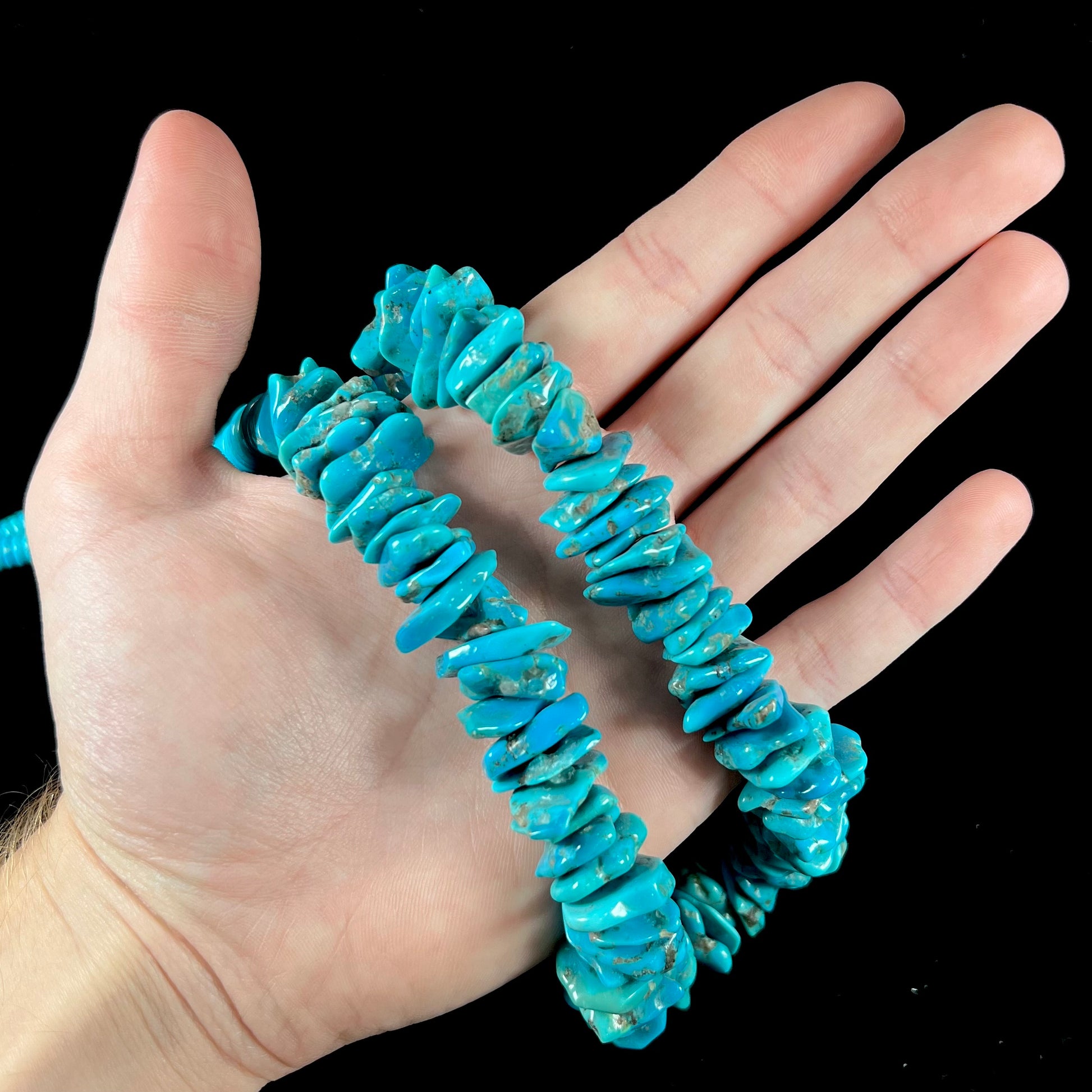 A men's turquoise stone bead necklace made from polished Kingman and Sleeping Beauty Mine turquoise.