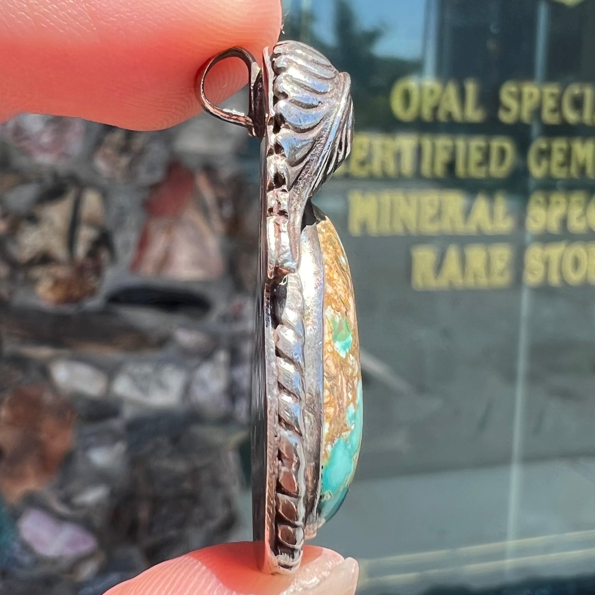 A handmade silver Navajo style pendant set with a turquoise stone from Kingman, Arizona.