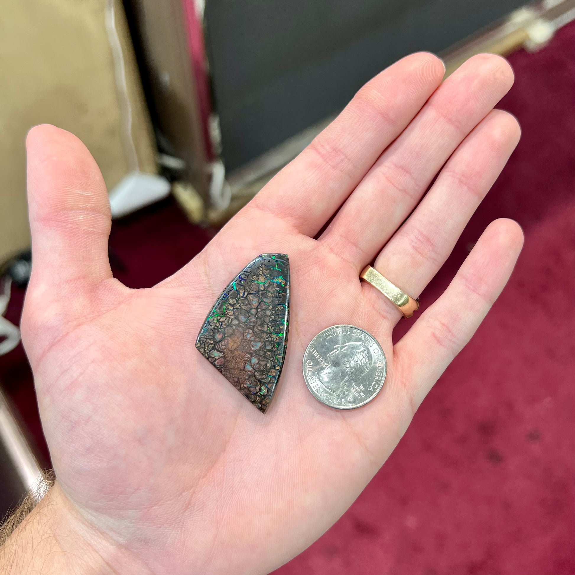 A loose, patterned boulder opal stone from the Koroit Mining District in Queensland, Australia.