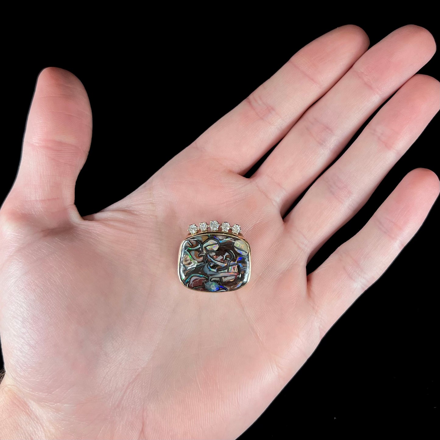 A ladies' yellow gold Koroit boulder opal and diamond slider pendant.