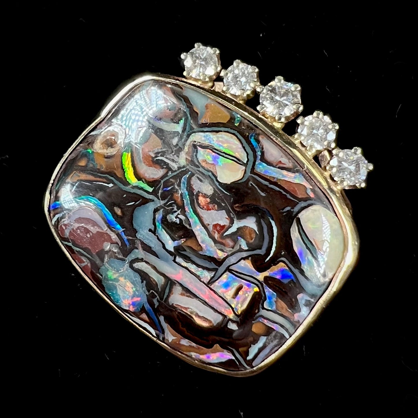 A ladies' yellow gold Koroit boulder opal and diamond slider pendant.