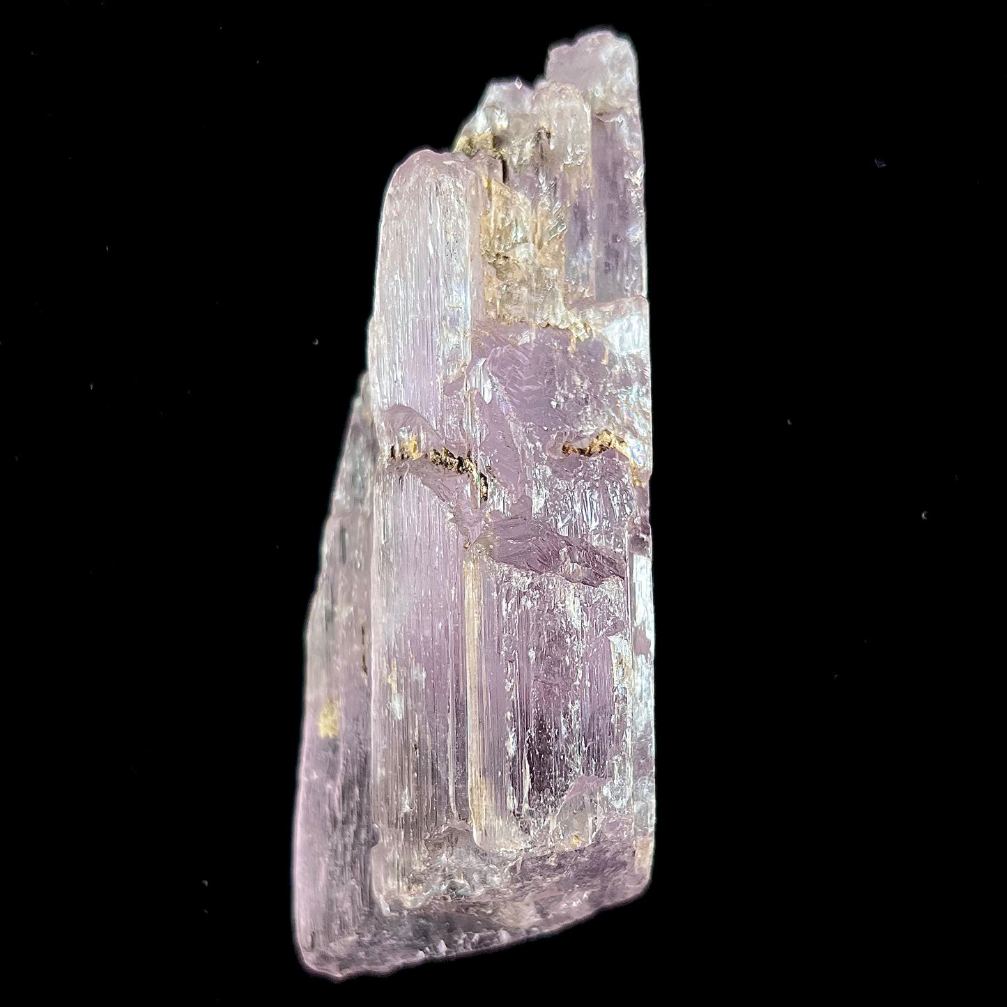 A five inch long pink kunzite crystal.  The crystal is purple when viewed down the ends.