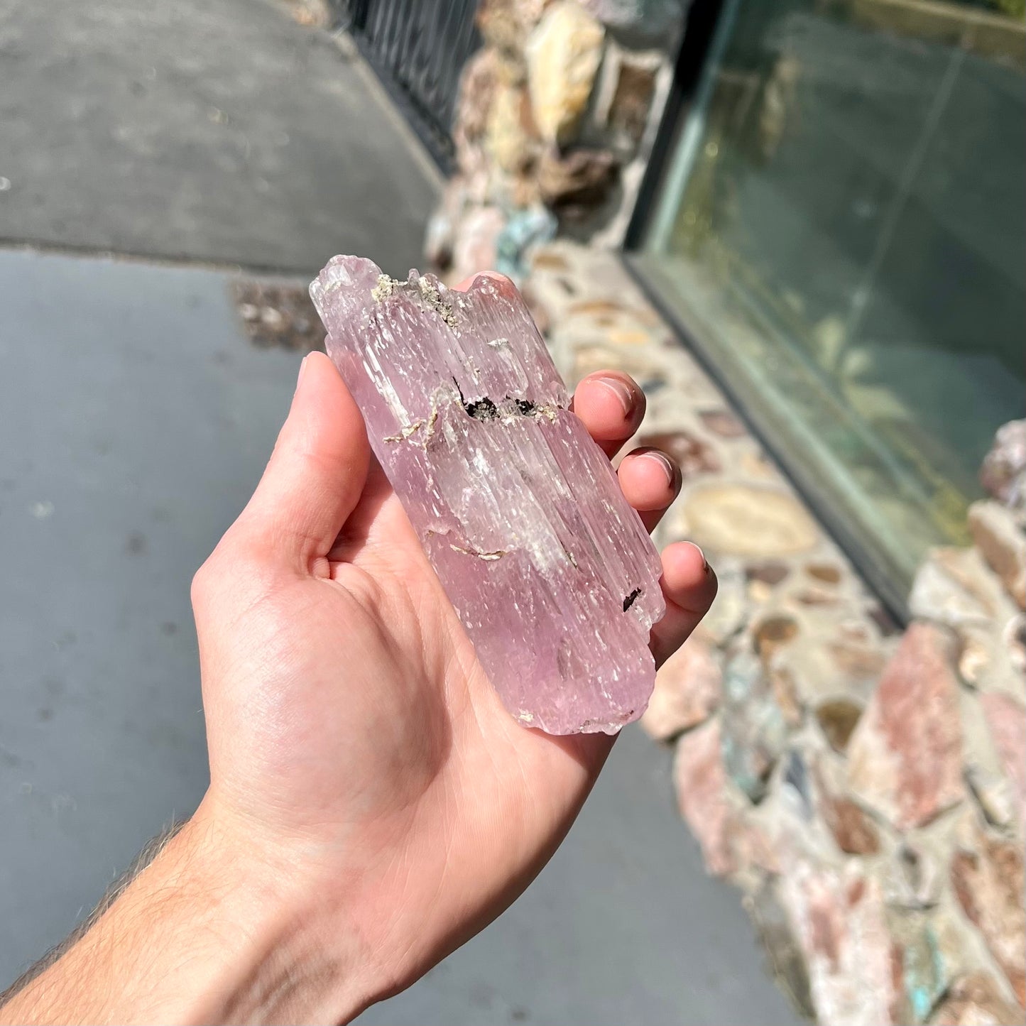 A five inch long pink kunzite crystal.  The crystal is purple when viewed down the ends.