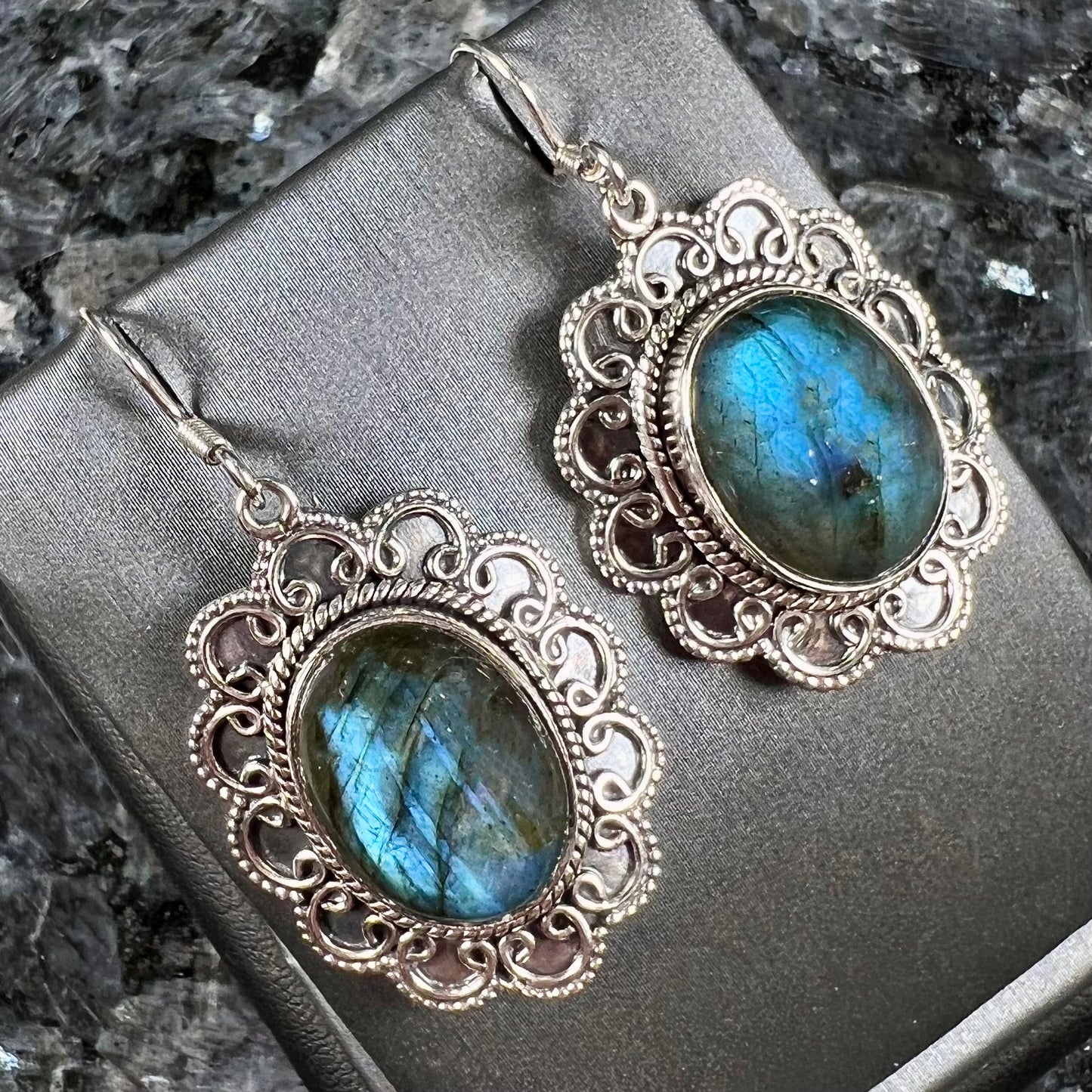 A pair of Southwest style sterling silver labradorite dangle earrings.