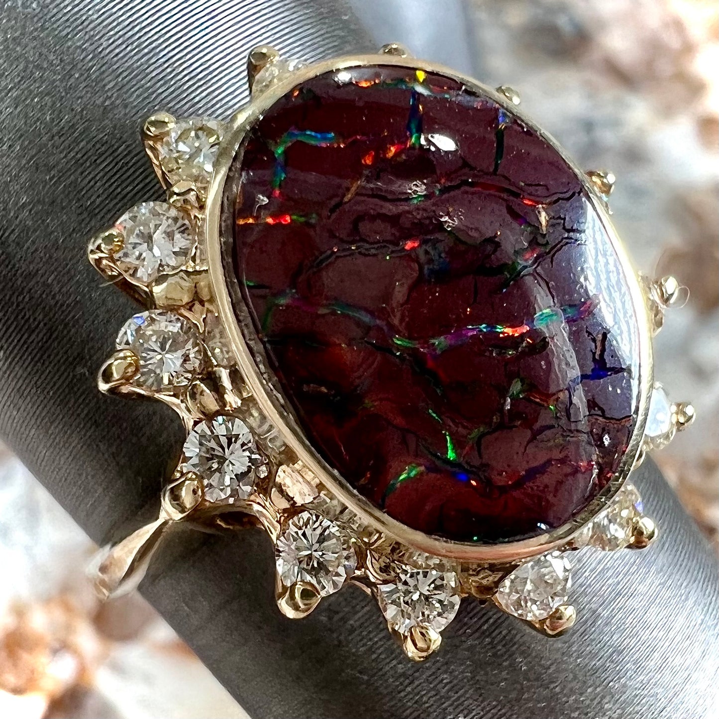 A ladies' diamond halo and Koroit boulder opal engagement ring.