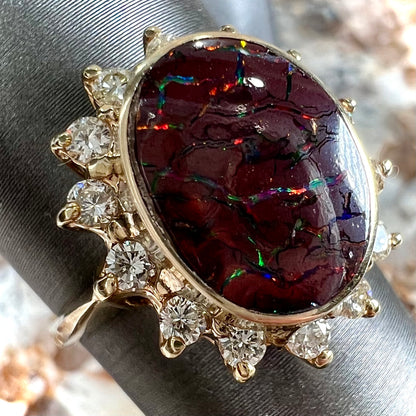 A ladies' diamond halo and Koroit boulder opal engagement ring.