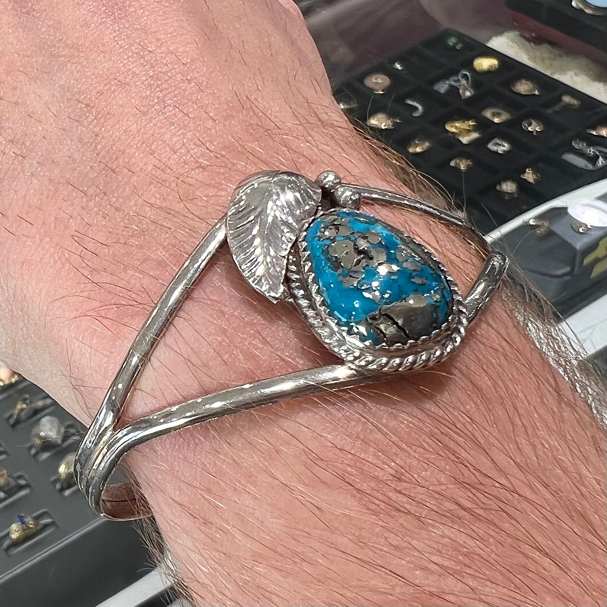 A ladies' silver Navajo cuff bracelet set with a piece of Morenci turquoise stone.