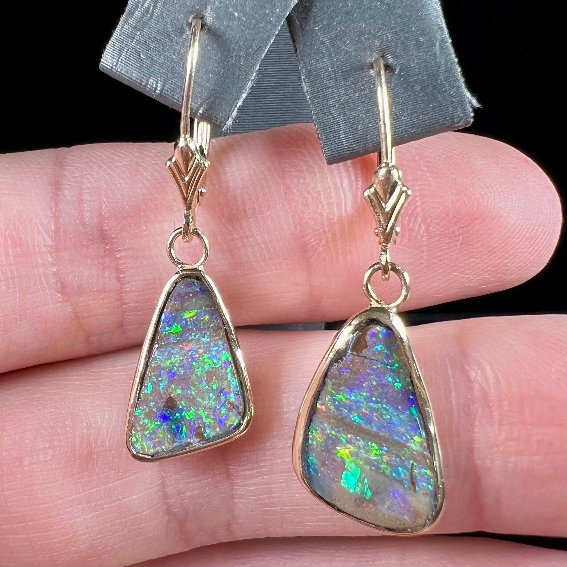 A pair of Australian boulder opal dangle earrings.