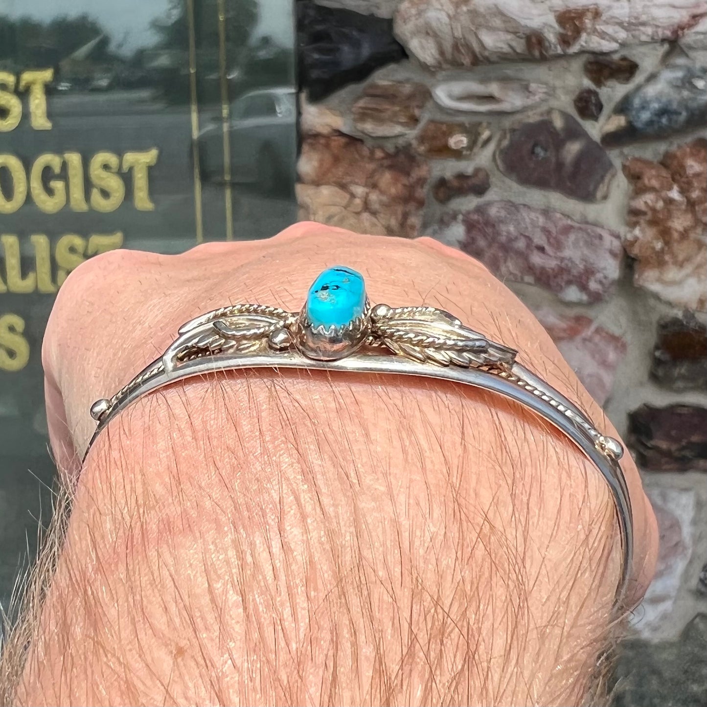 A ladies' sterling silver turquoise cuff bracelet.