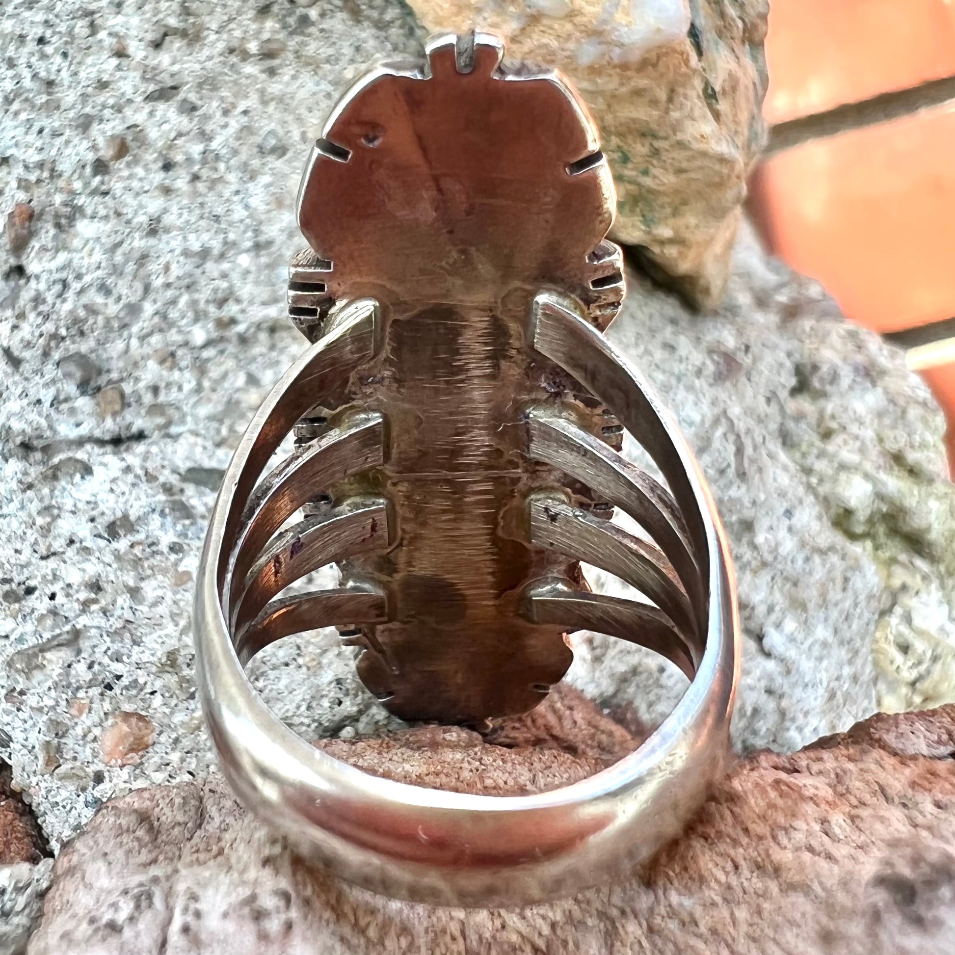 A Navajo style sterling silver lapis lazuli ring engraved with the words "R. Bennett".