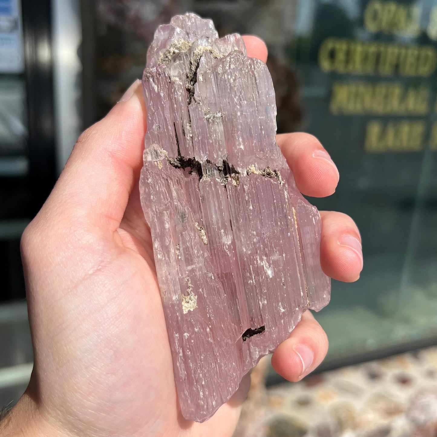 A five inch long pink kunzite crystal.  The crystal is purple when viewed down the ends.