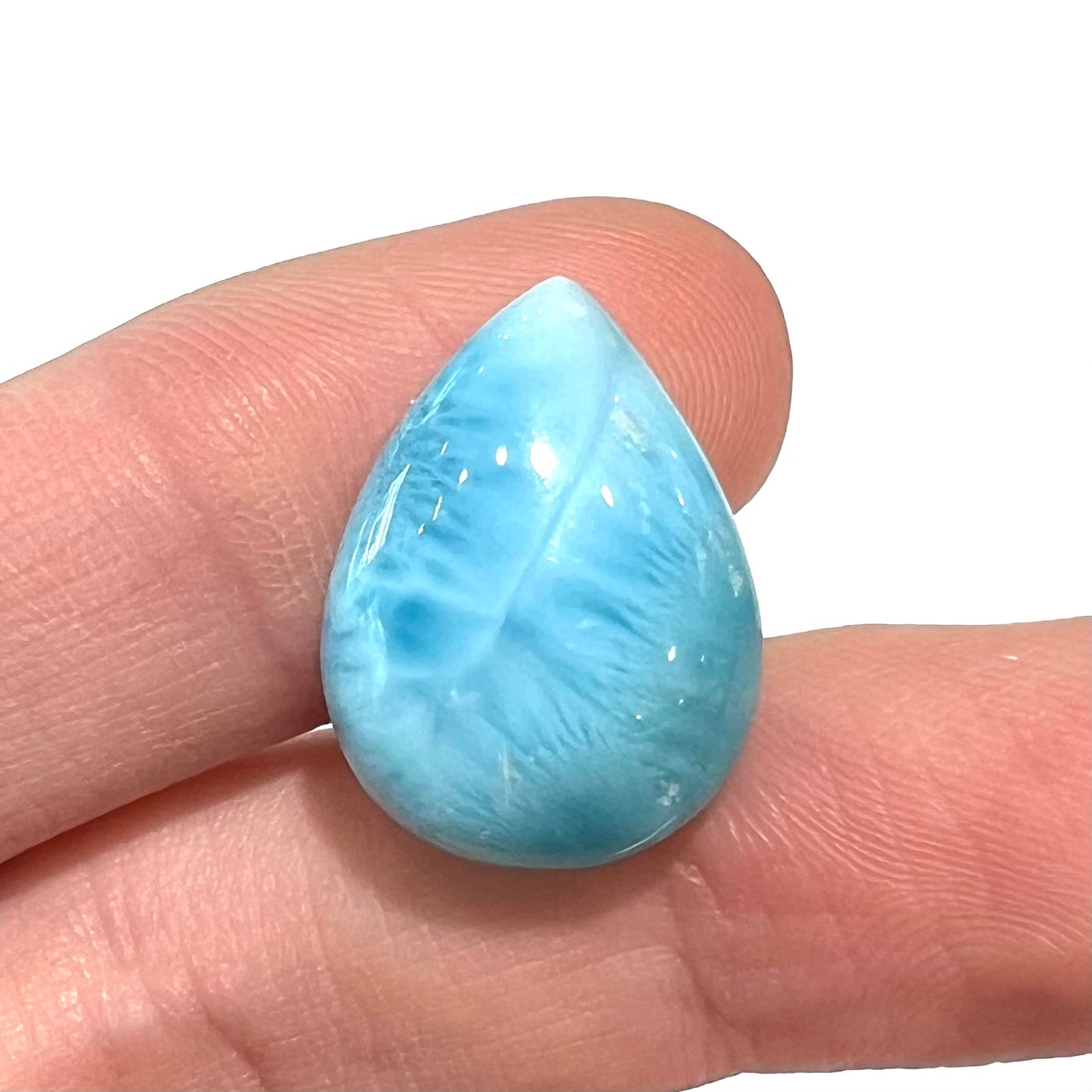 A pear shaped, AAA grade larimar cabochon from Dominican Republic.