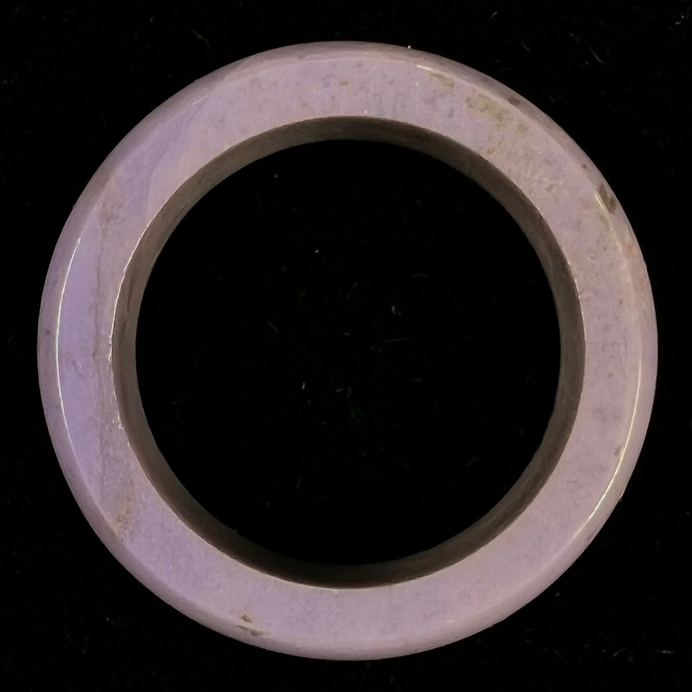A carved lavender jade stone band.