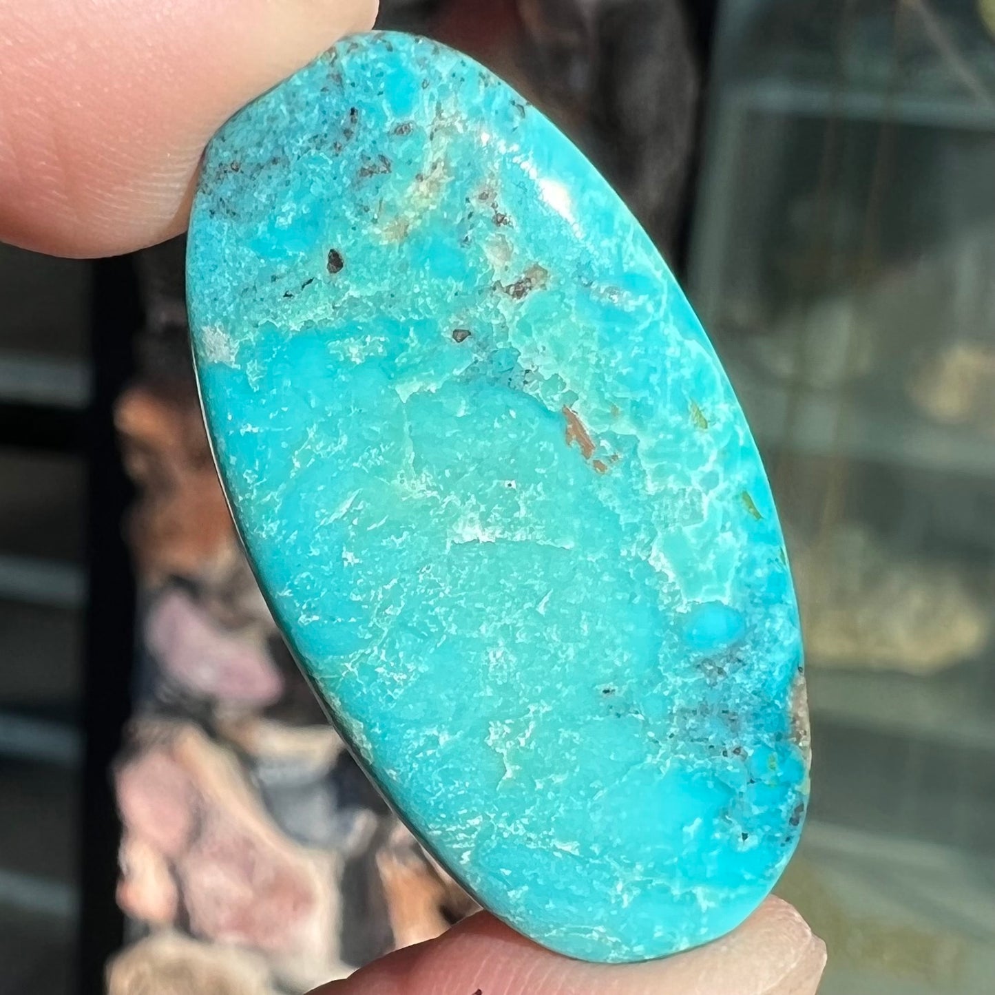 One loose oval cut blue turquoise stone from Bisbee, Arizona.