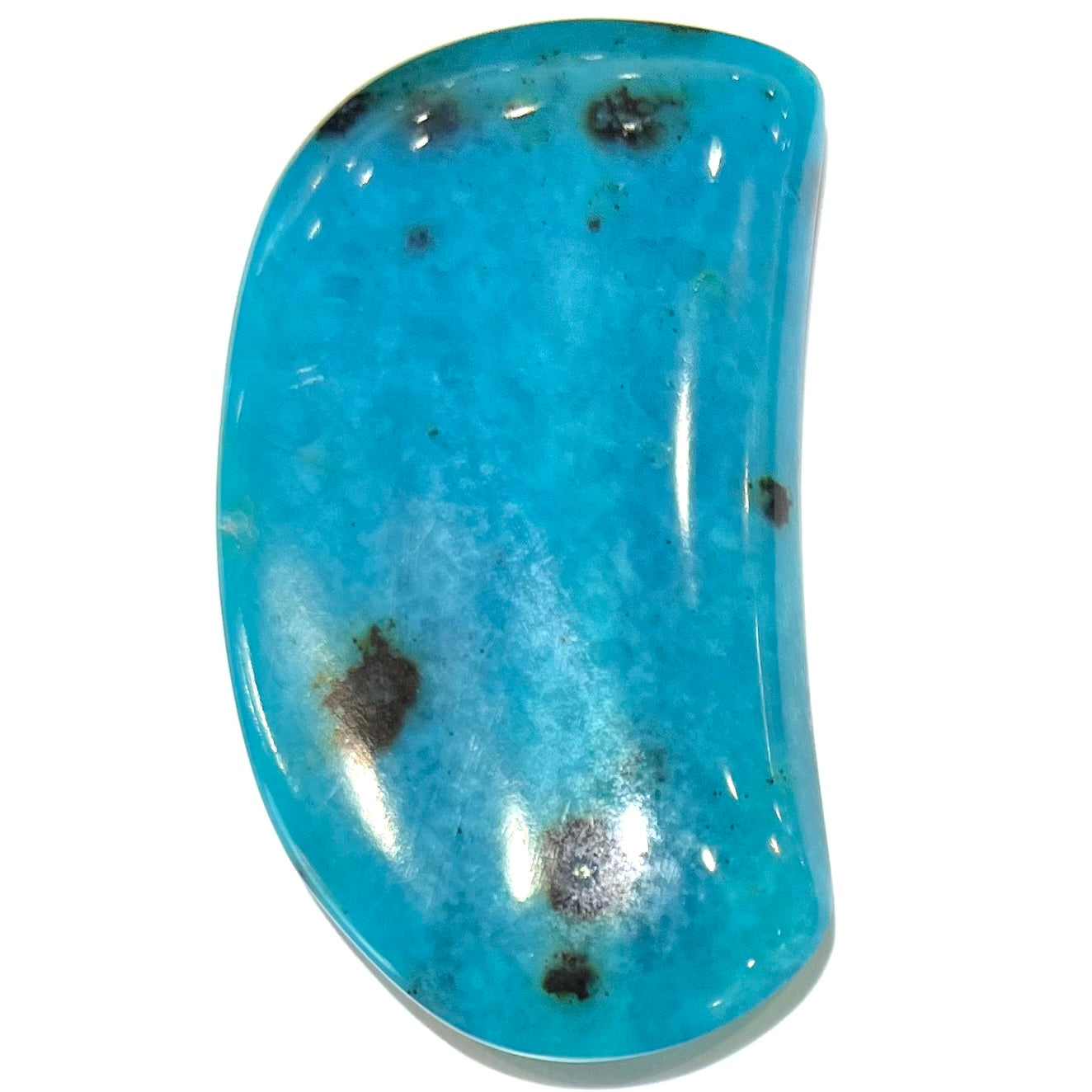 A loose, polished, spotted blue chrysocolla stone.