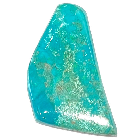 A freeform cut chrysocolla stone cabochon.