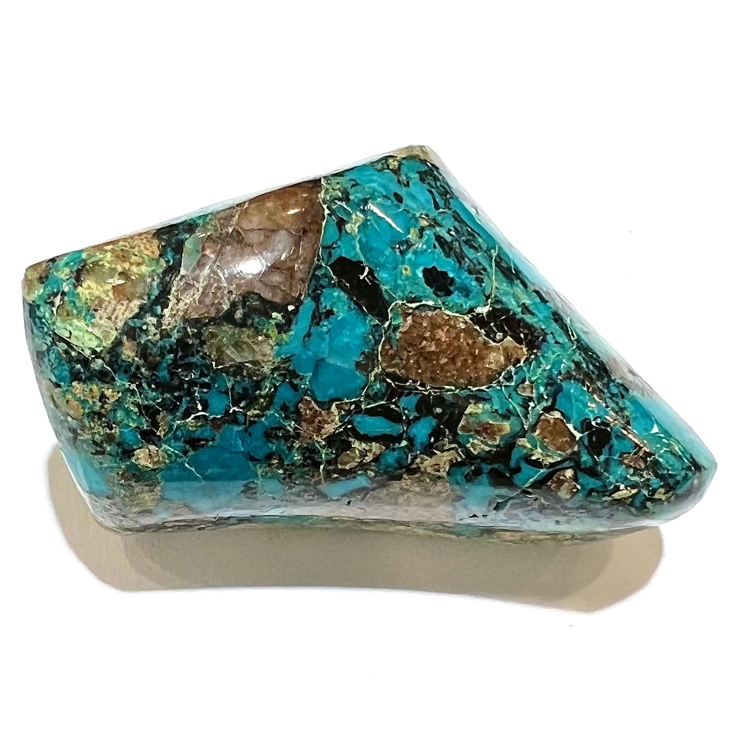 A loose polished chrysocolla stone with malachite inclusions.