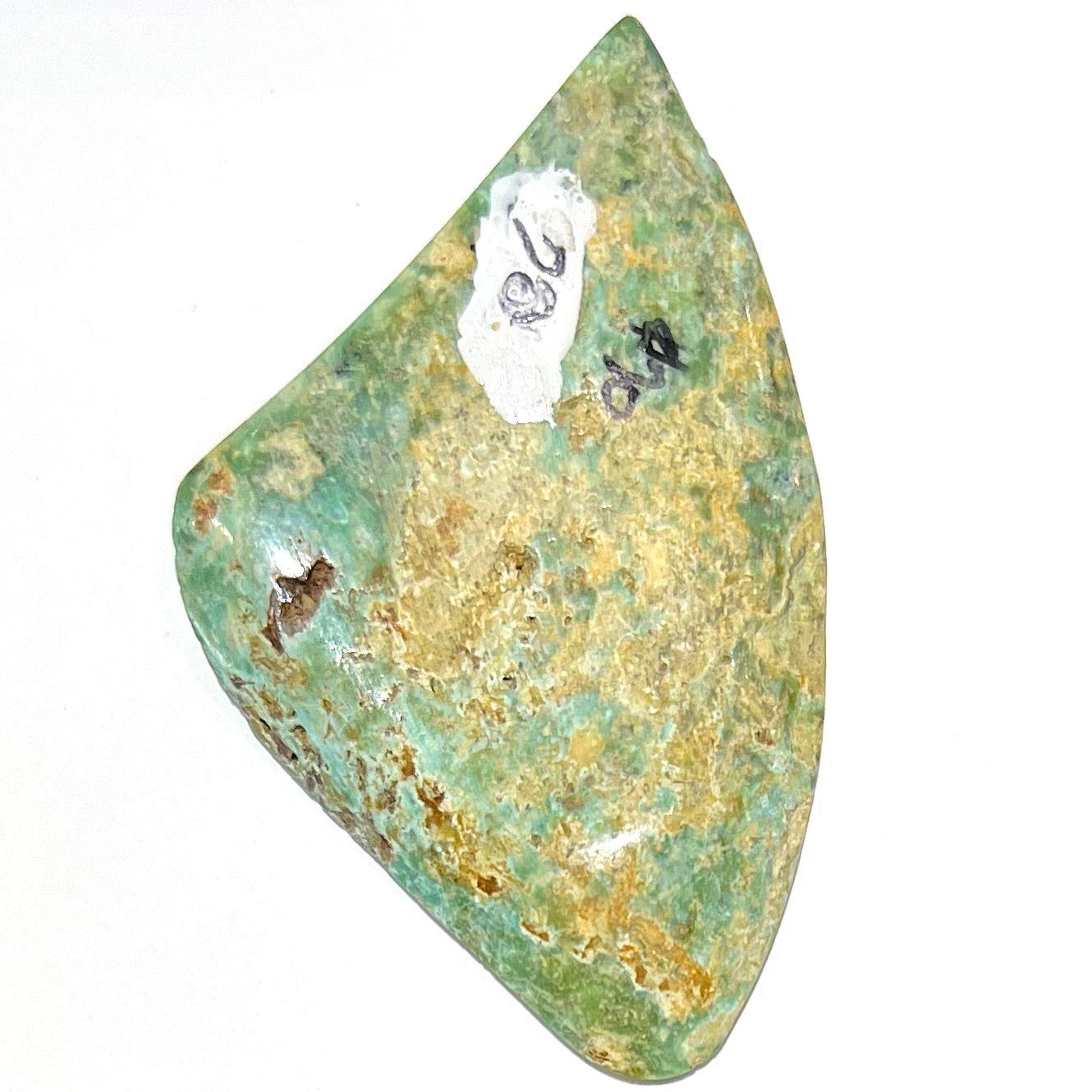 A triangular cut polished green turquoise stone from Morenci, Arizona.