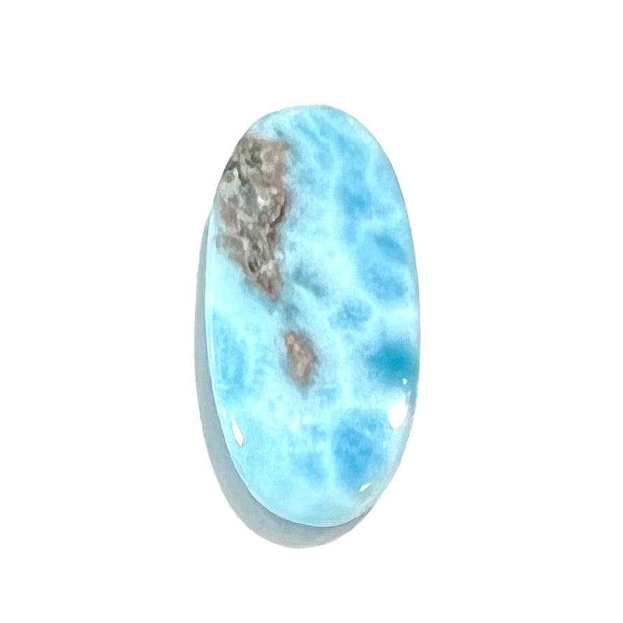 A loose, oval cabochon cut larimar stone from Dominican Republic.