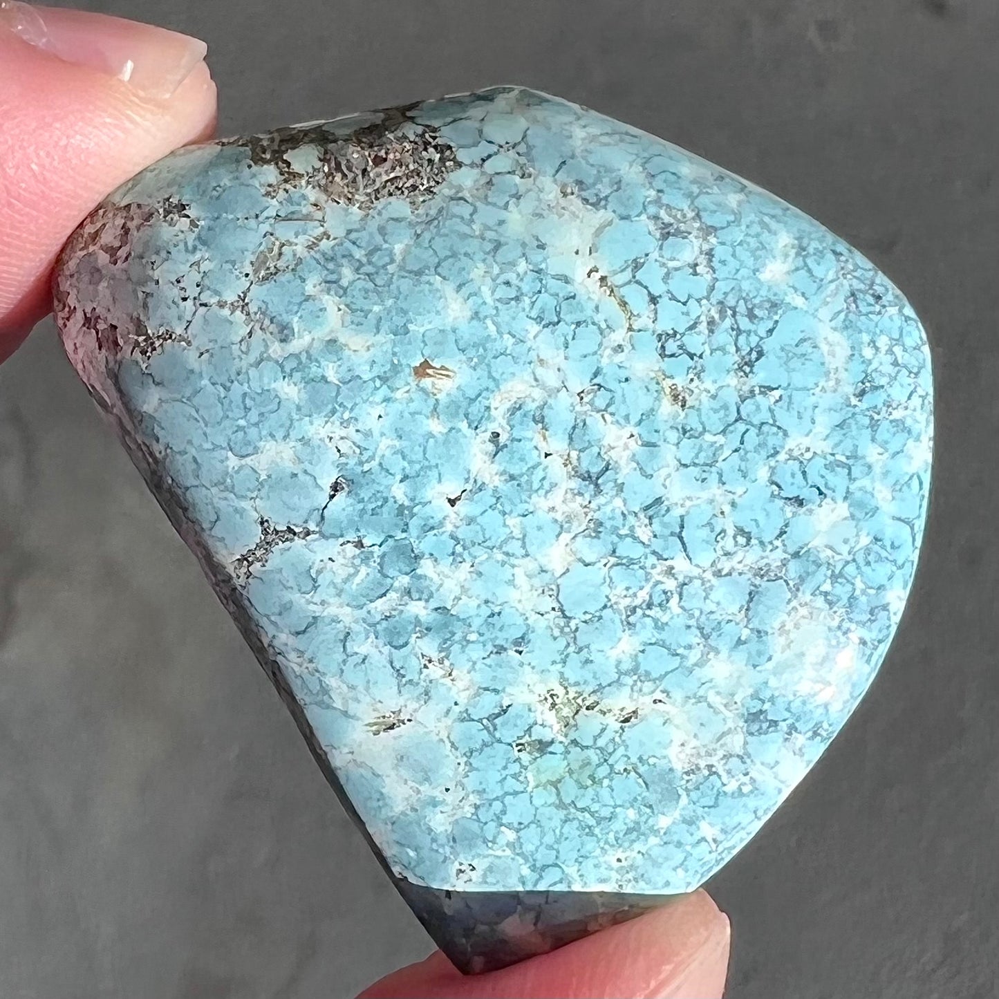 Loose light blue turquoise stone with gray matrix from Baja California, Mexico.