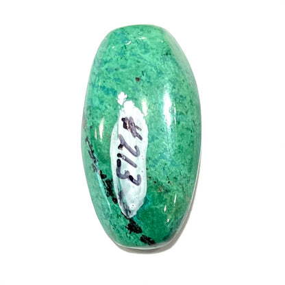 A loose, green turquoise cabochon from Royston District, Nevada.