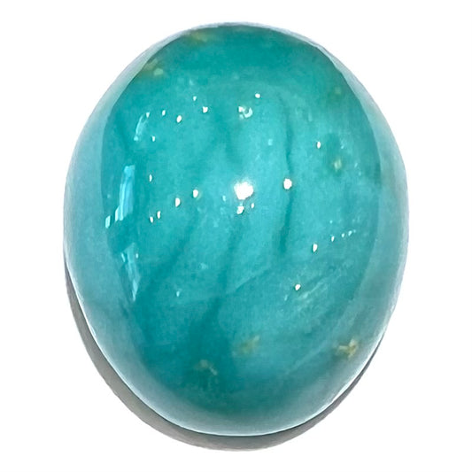 An oval cabochon cut blue turquoise stone from Royston District, Nevada.