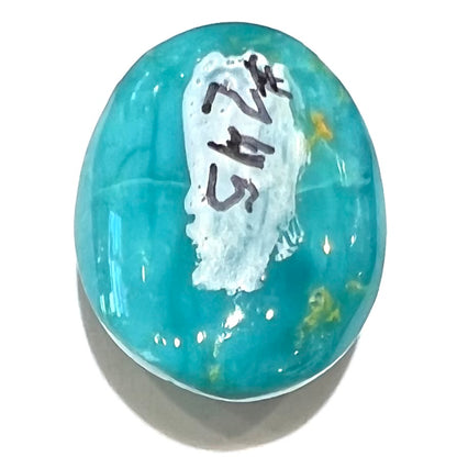 An oval cabochon cut blue turquoise stone from Royston District, Nevada.