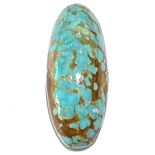 An oval cabochon cut loose turquoise stone from the Number 8 Mine in Nevada.  Blue with chocolate matrix.
