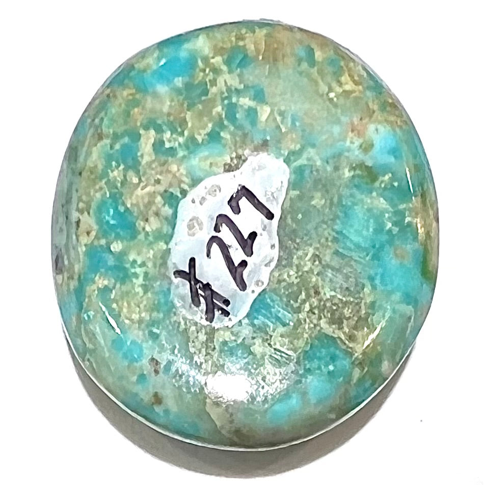 A loose, sky blue, oval cut cabochon turquoise stone from Royston District, Nevada.