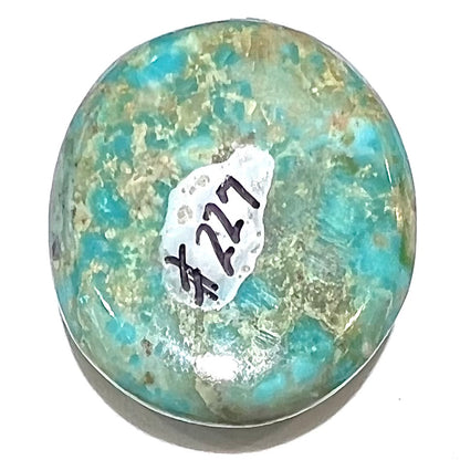A loose, sky blue, oval cut cabochon turquoise stone from Royston District, Nevada.