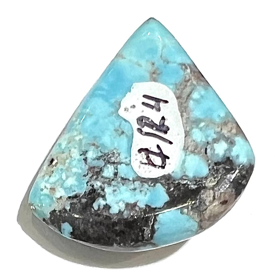 A loose triangular cabochon cut turquoise from the Valley Blue Mine in Lander County, Nevada.
