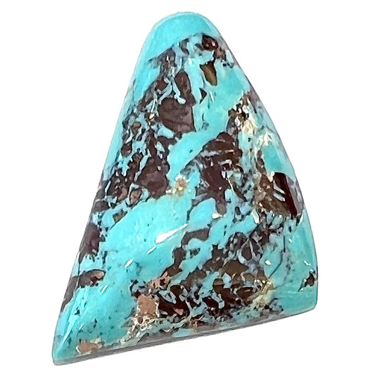 A triangular cabochon cut blue turquoise with red matrix from Mohave County, Arizona.