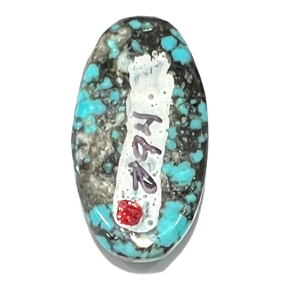 A loose, oval cabochon cut turquoise stone from the Valley Blue Mine in Lander County, Nevada.