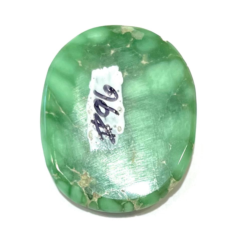 A loose, oval cabochon cut variscite stone from Utah, USA.