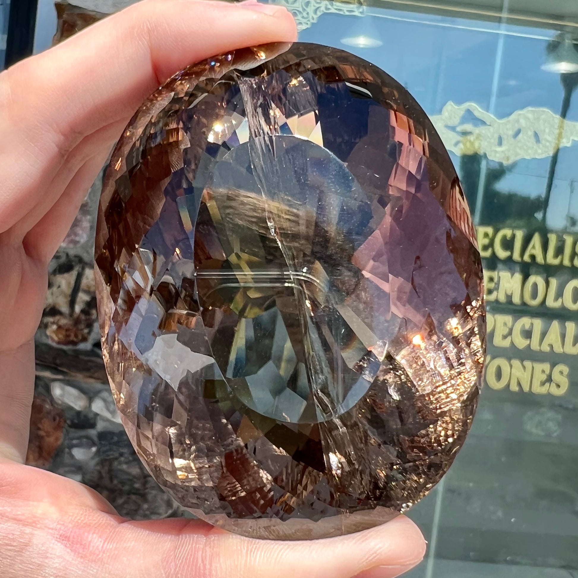 A loose, 1400+ carat smoky quartz gemstone.  The stone has a fracture that runs throughout the stone to the table.