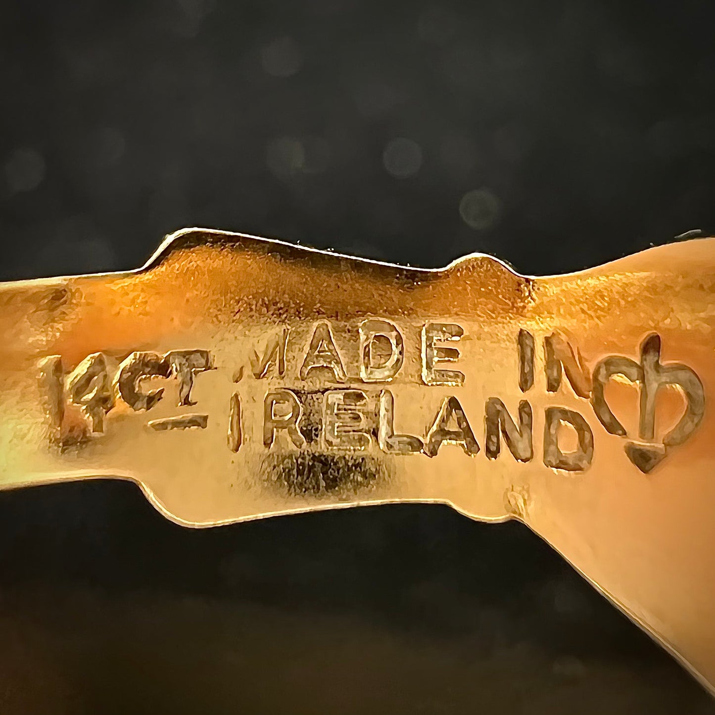 A ladies' 14 karat yellow gold Irish claddagh ring stamped with the maker's hallmarks.