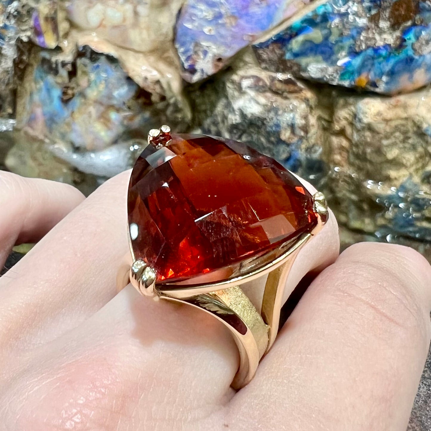 A ladies' trillion cut madeira citrine cocktail ring handmade in yellow gold.