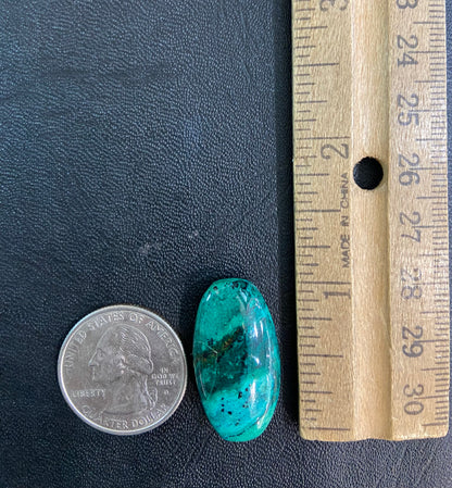 A loose, green turquoise cabochon from Royston District, Nevada.