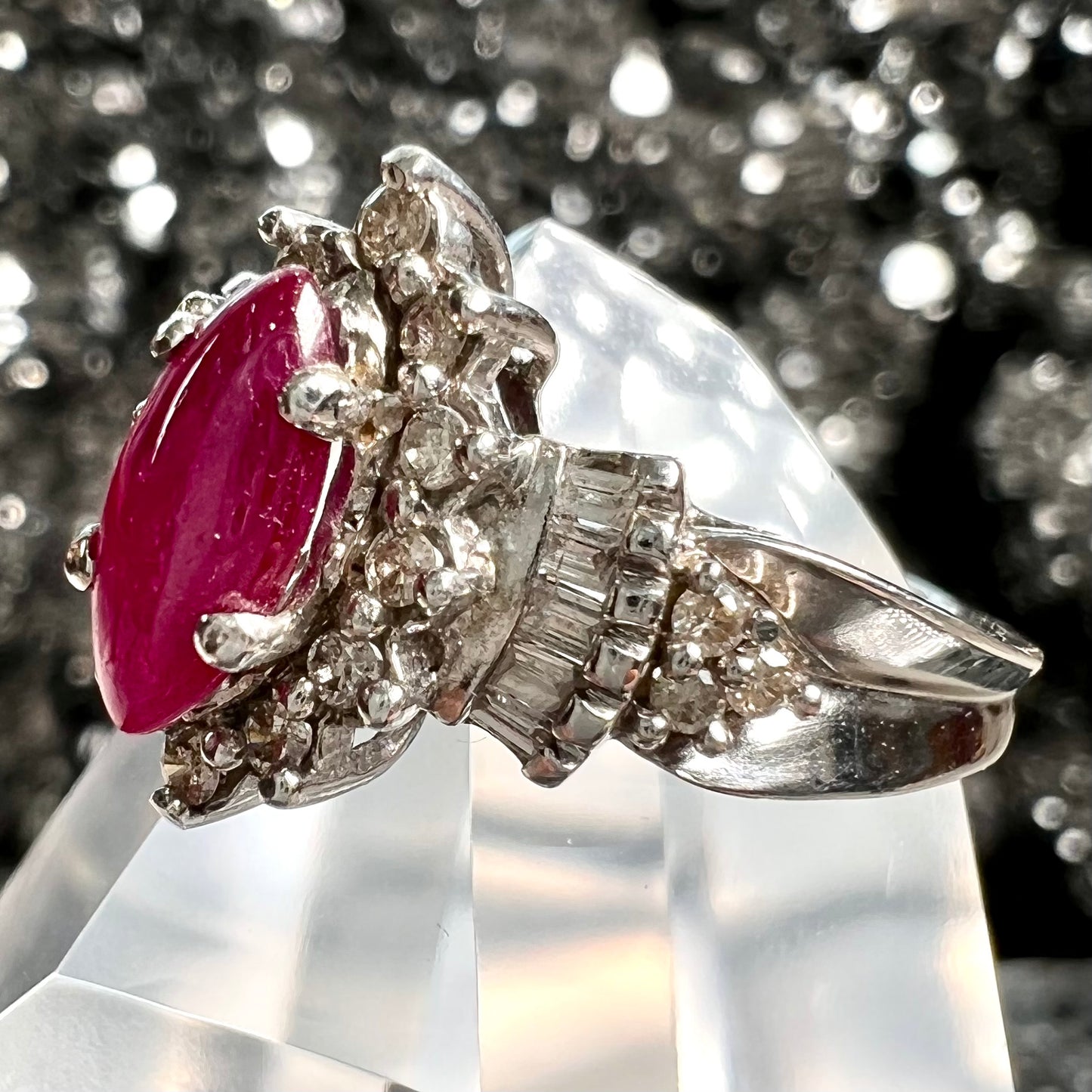 A vintage style white gold marquise cabochon cut ruby and diamond ring.